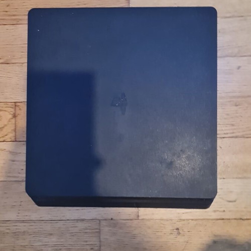 PlayStation 4 Slim 500GB console with controller, HDMI and power cable