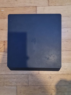 PlayStation 4 Slim 500GB console with controller, HDMI and power cable