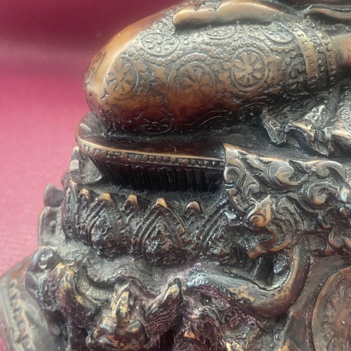 Thai Buddha statue with detailed embossed decoration