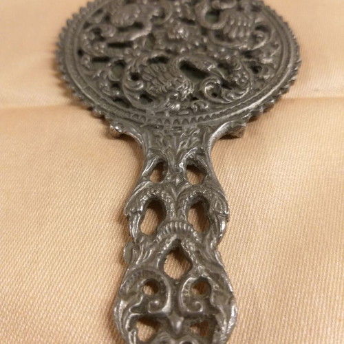 Carved old hand mirror used