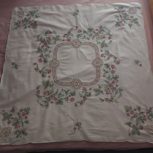 Handmade counted embroidery with handmade lace used
