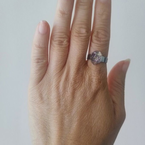 Floral ring handmade with lilac flowers in epoxy resin