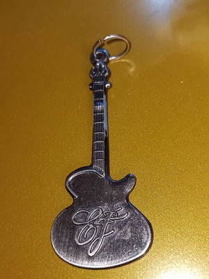 Stainless steel necklace like new, pendant shaped as electric guitar