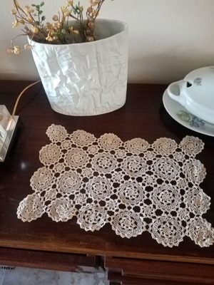 Handmade ecru doily with fine cotton thread and lace