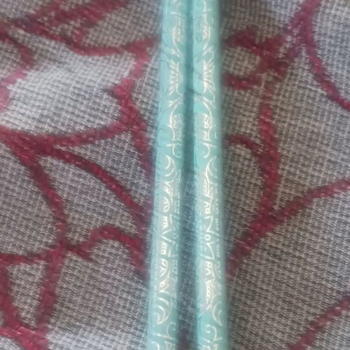 Set of 2 light green pencils with designs