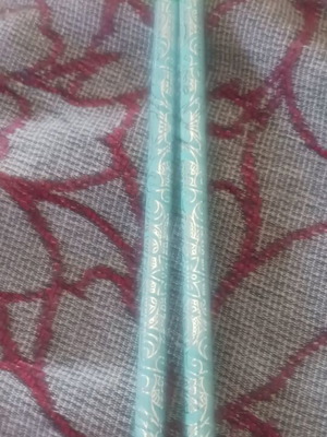 Set of 2 light green pencils with designs