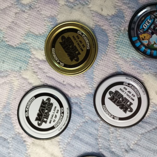 Marvel Slingers game used with launcher and 9 medals