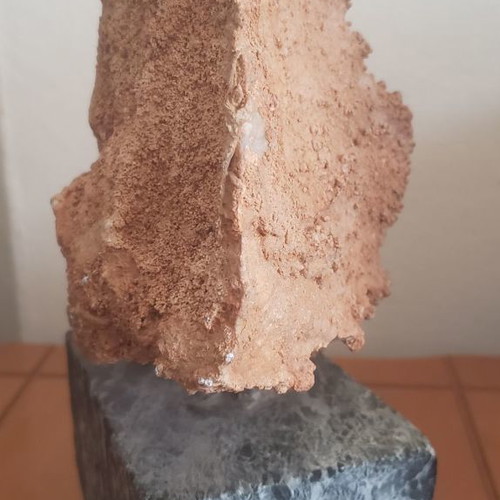 Natural raw mountain crystal used on large marble base