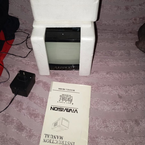 Vintage portable black and white television with radio like new