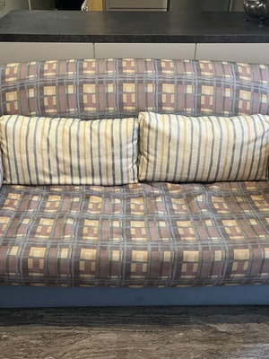 Two-Seater Sofa Bed used, practical and space-saving