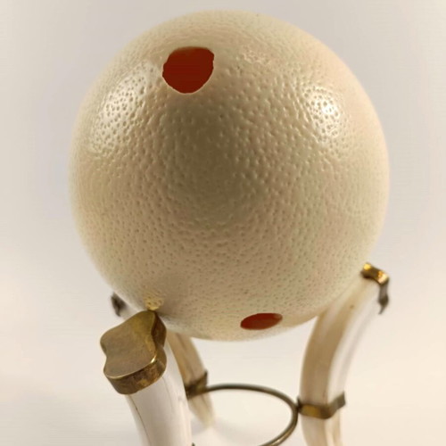 Tripod base used from fakocheros teeth with ostrich egg