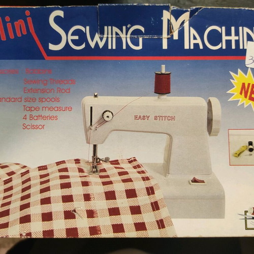 Mini sewing machine used with threads and battery operation