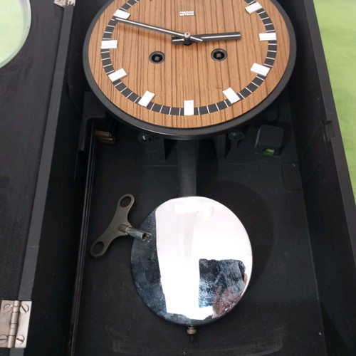 Wooden wall clock used, dimensions 45x25 cm