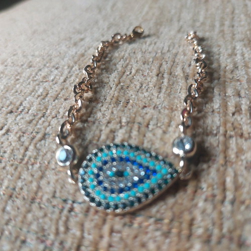 Gold bracelet new with eye and blue, turquoise, white stones