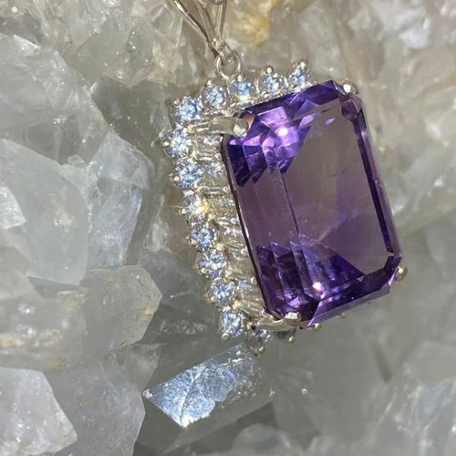 Silver pendant with large cut natural amethyst stone and moissanites