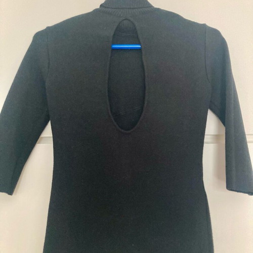 Zini black turtleneck like new, size small, with feathers and back opening