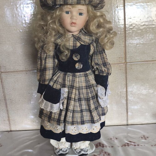 Porcelain doll vintage collective used with dress stains