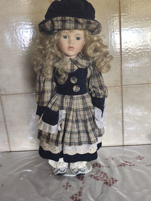 Porcelain doll vintage collective used with dress stains