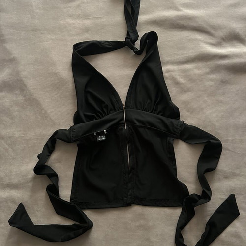 Black halter top with gold detail and open back