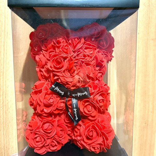 Handmade teddy bear made of red artificial roses