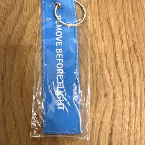Dnata Remove Before Flight keychain new, blue from Dubai