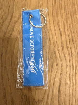 Dnata Remove Before Flight keychain new, blue from Dubai