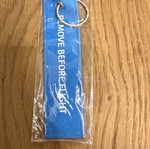 Dnata Remove Before Flight keychain new, blue from Dubai