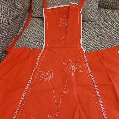 Vintage German kitchen apron 1960s, deadstock, red with floral appliqué