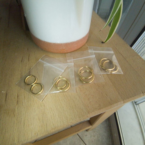 Gold stainless steel hoop earrings, 4 pairs, new in packaging