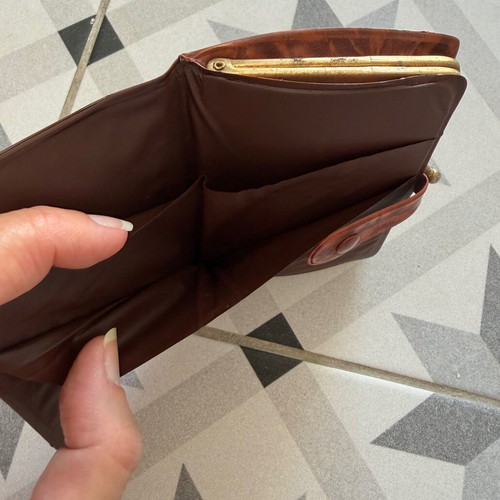 Vintage brown leather wallet used with frame closure