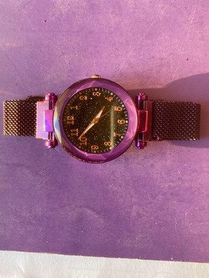 Women's watch like new with metal strap, black and purple