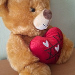 Stuffed teddy bear with heart
