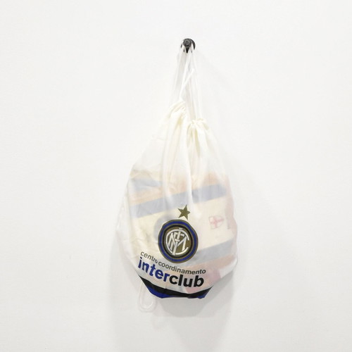 Inter collection with scarves, pennants, cufflinks, magazines and backpack