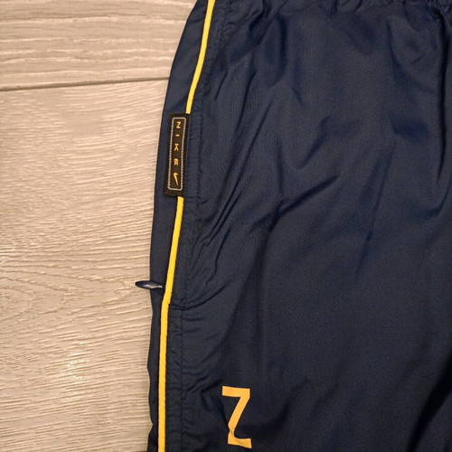 Vintage Nike track pants navy with yellow stripes like new