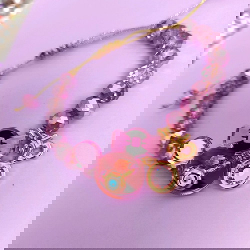 Minnie βραχιόλι λιλά/ροζ/χρυσό like new με ματάκι και ροζ πέτρα