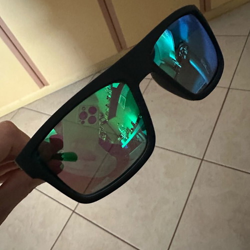 Polarized sunglasses new with green lens and black frame
