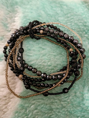Elastic bracelets set with beads like new, black and gray