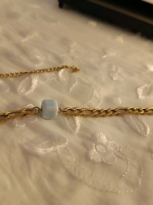 Ankle bracelet like new with light blue square stone gold color