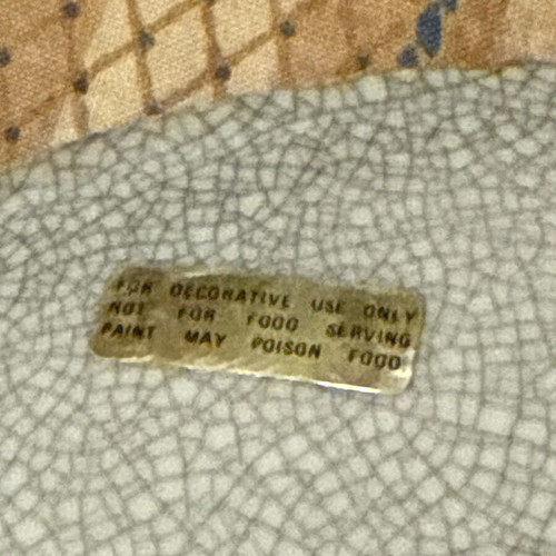 Decorative handmade plate used with embossed design and damage