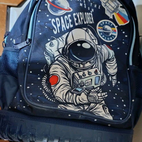 School bag for primary used with space theme and wheels