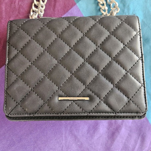Quilted bag with metal strap like new, black