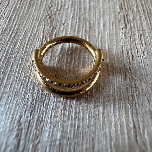Gold septum piercing earring with sparkling stones