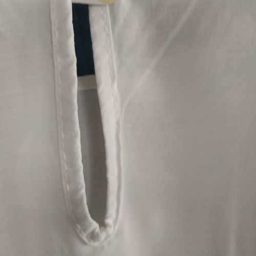 Women's blouse like new with lace sleeves and back button opening, size M