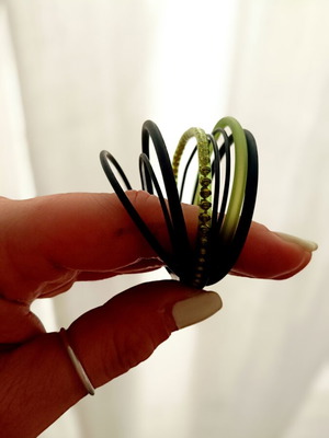 Layered bracelet with metal clasp like new, black and green rubber