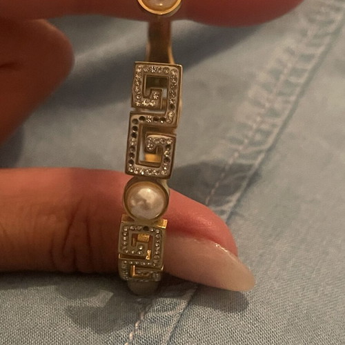 Steel bracelet used, gold color with meander design, crystals and pearls