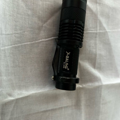 Small handheld flashlight like new, operates with AA battery