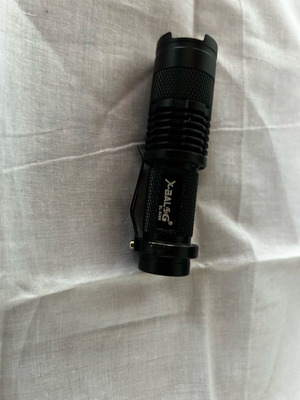 Small handheld flashlight like new, operates with AA battery