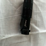 Small handheld flashlight like new, operates with AA battery