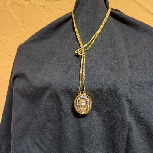 Pendant like new gold-tone horseshoe with zircon crystal