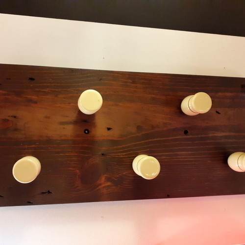 Wooden wall hanger with handles from old barber shaving brushes